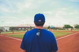 man overlooking baseball field